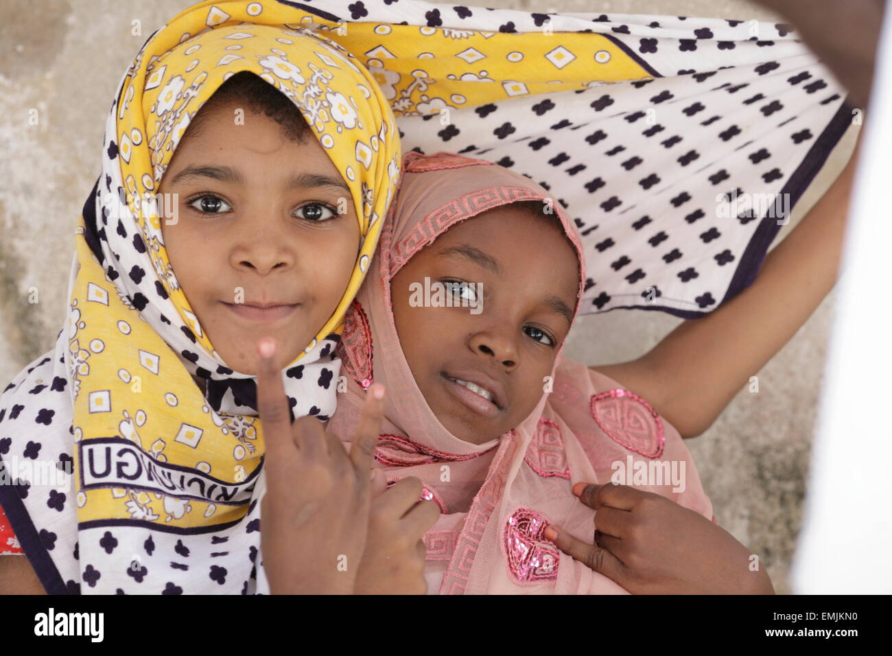 Two young girls in saris, Zanzibar Stock Photo