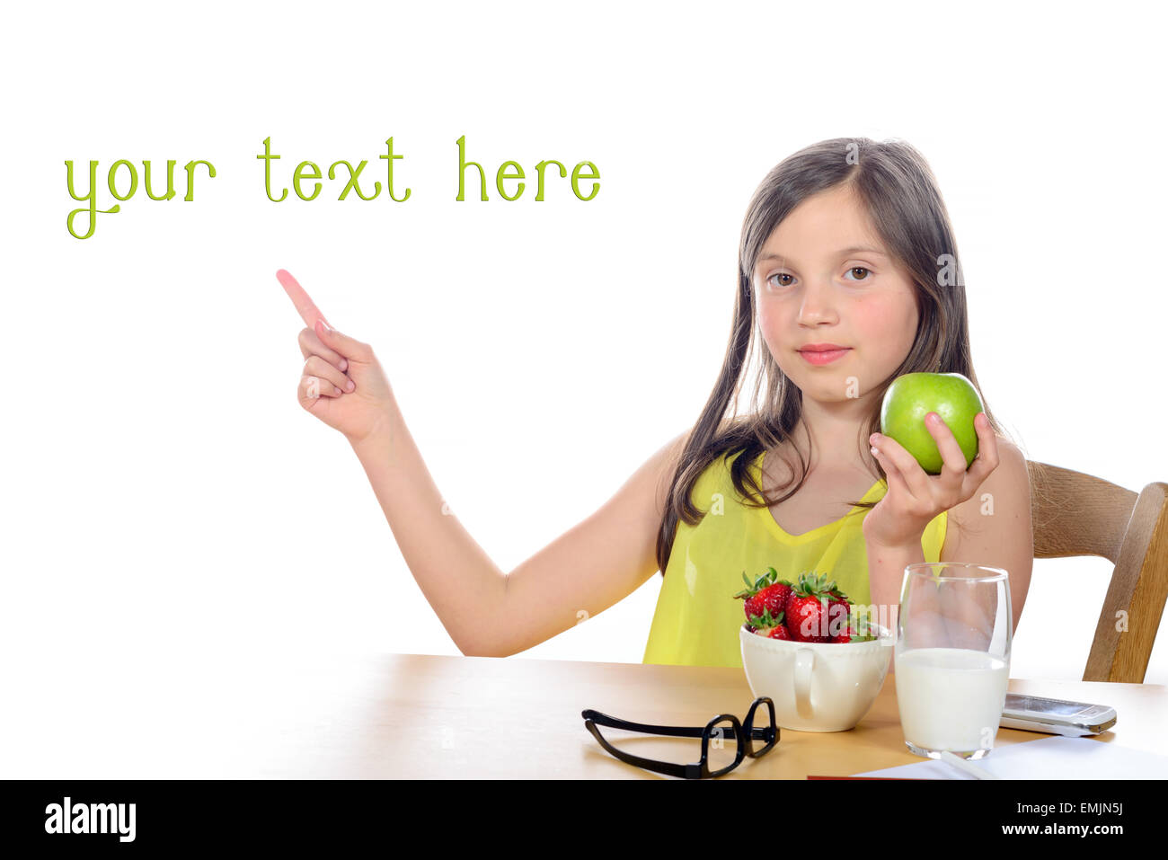 young girl with a green apple in her hand on white background Stock ...