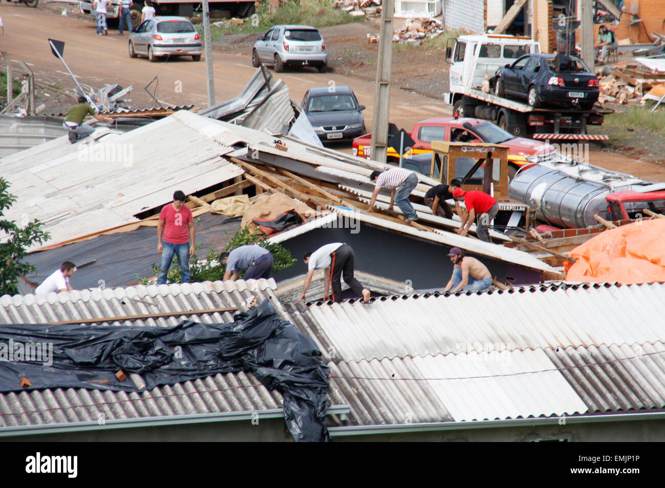 Xanxere, Brazil. 21st Apr, 2015. People repair a building that was damaged due to the passing of a tornado in Xanxere municipality, Santa Catarina state, Brazil, on April 21, 2015. Credit:  Rodrigo Vargas/Raw Image/AGENCIA ESTADO/Xinhua/Alamy Live News Stock Photo