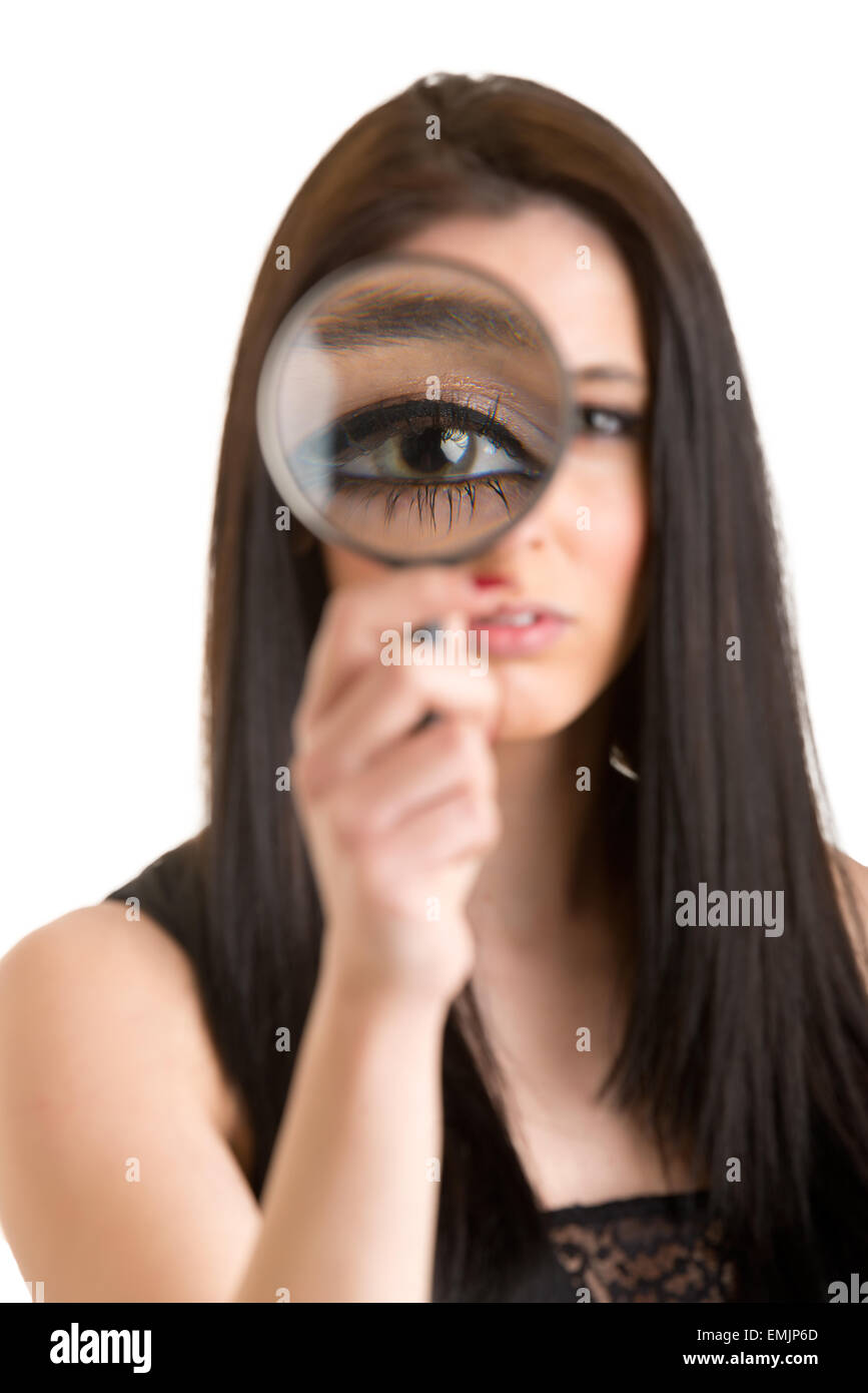 Woman looking through a loupe isolated in white Stock Photo - Alamy