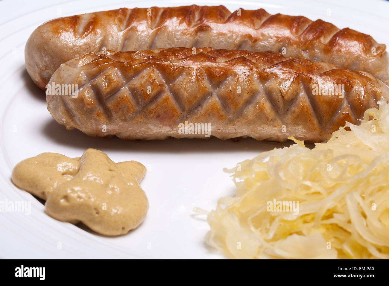 Grilled bratwurst with sauerkraut and mustard Stock Photo Alamy
