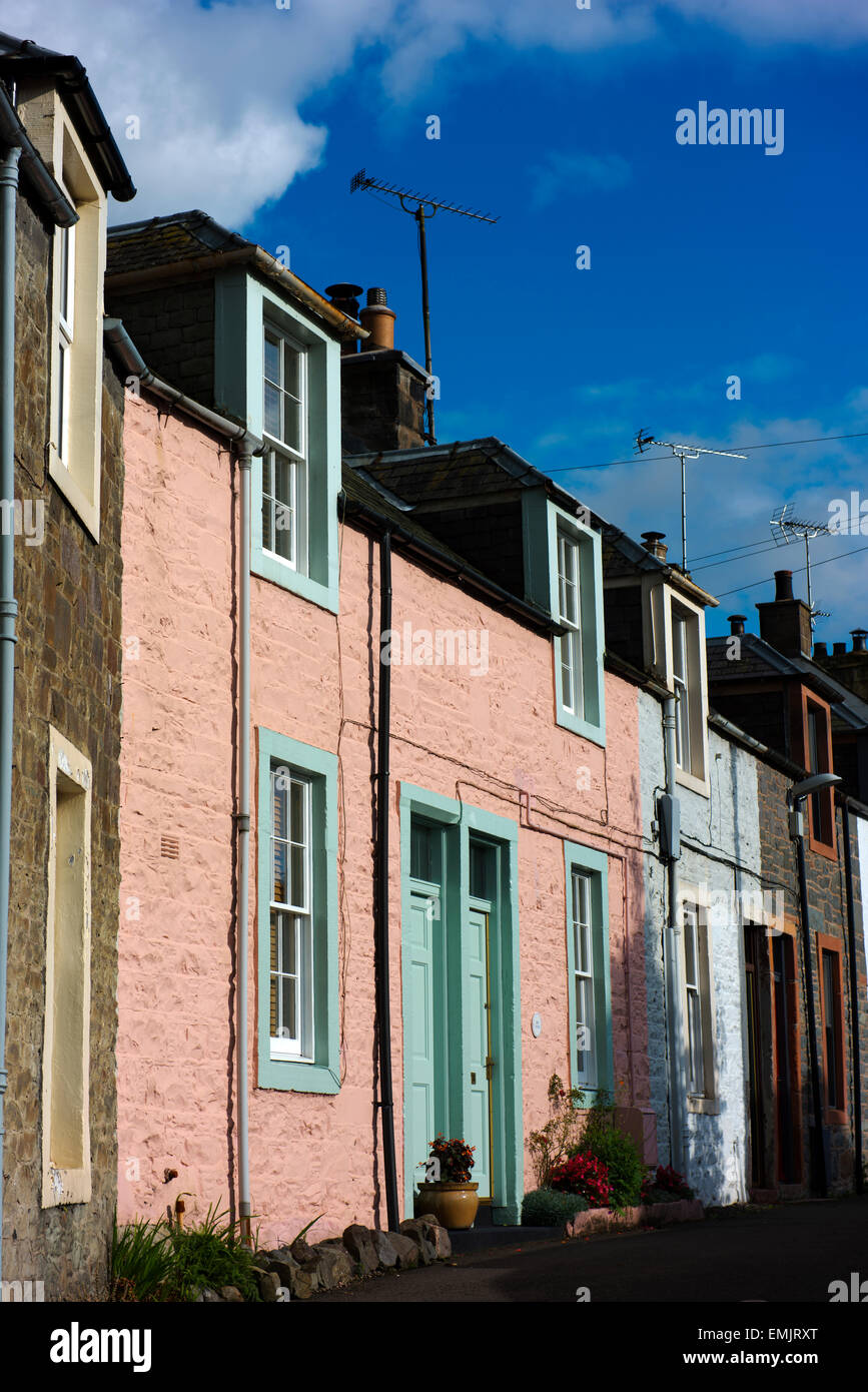 Traditional worker's cottages painted pastel colours in Moffat, a former spa town and centre for the wool trade. Stock Photo