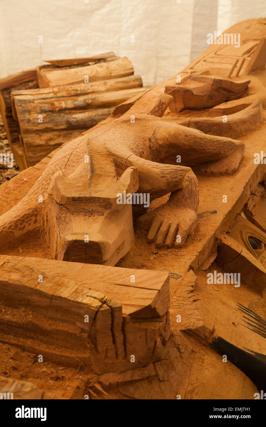 Detail of an animal character being carved on a totem pole at the ...