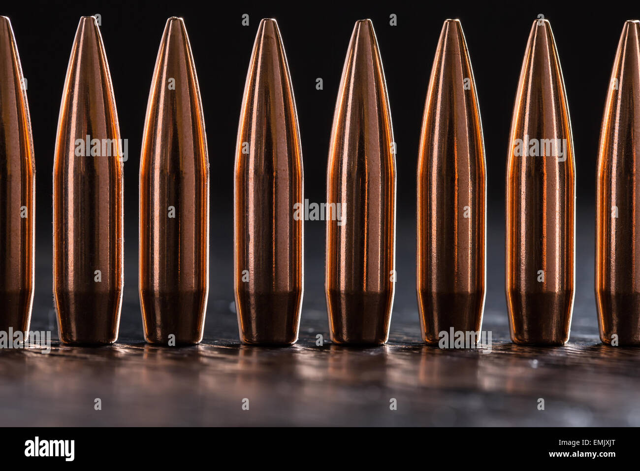 Macro shot of copper bullets that are in one row Stock Photo Alamy