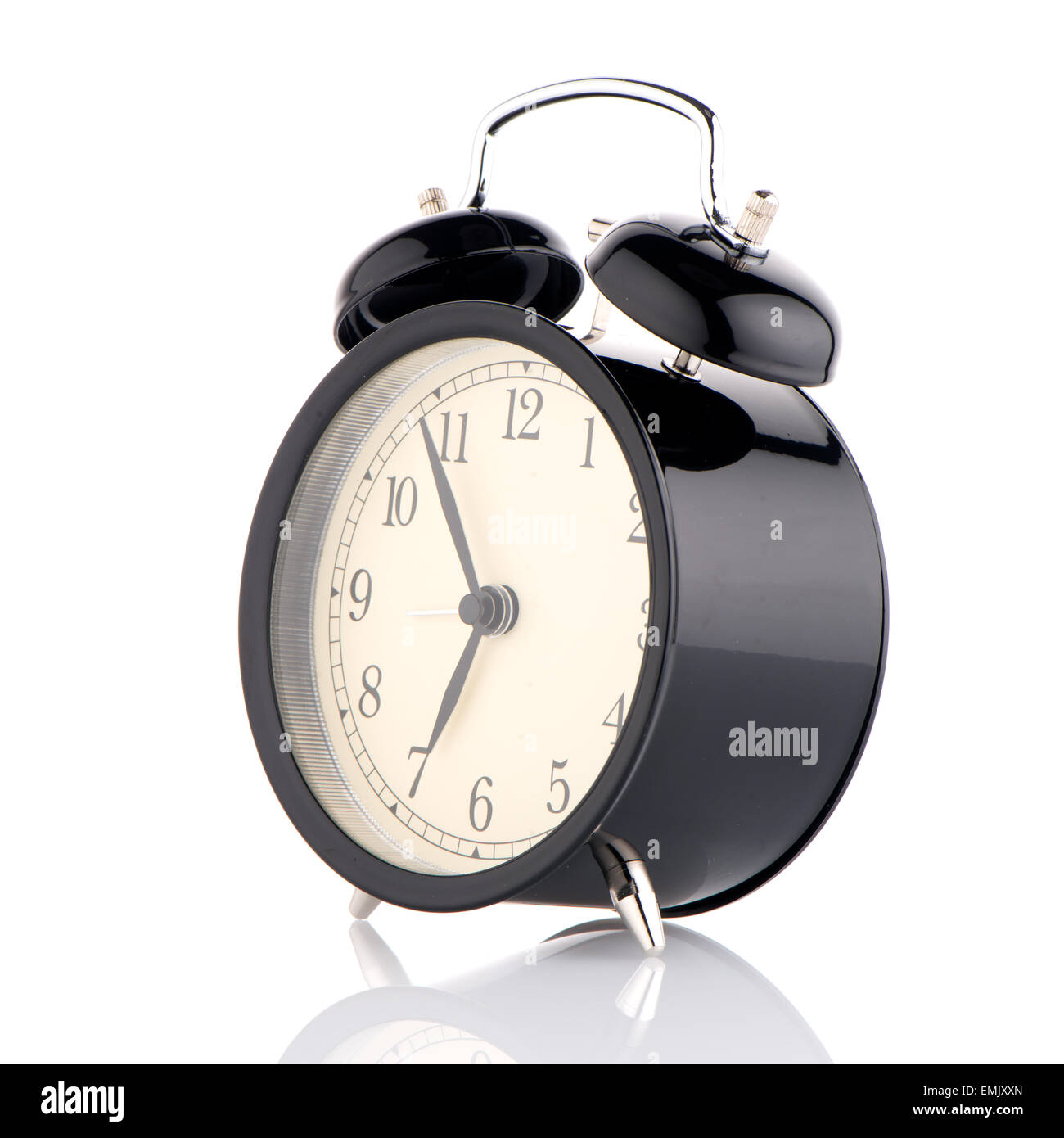 Old fashioned alarm clock on white background Stock Photo - Alamy