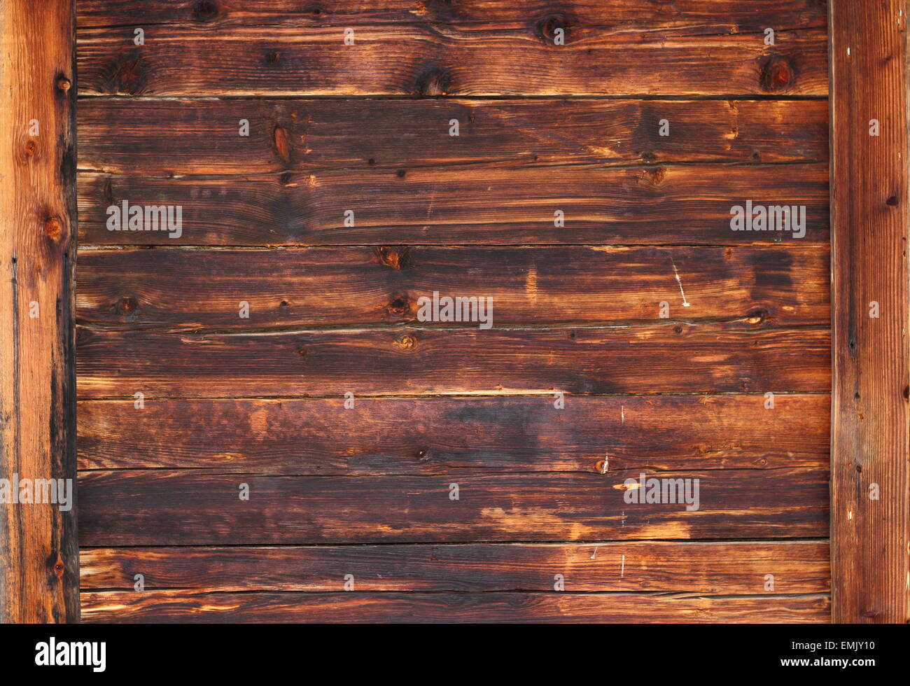 old wooden texture on facade of a lodge in the mountains Stock Photo