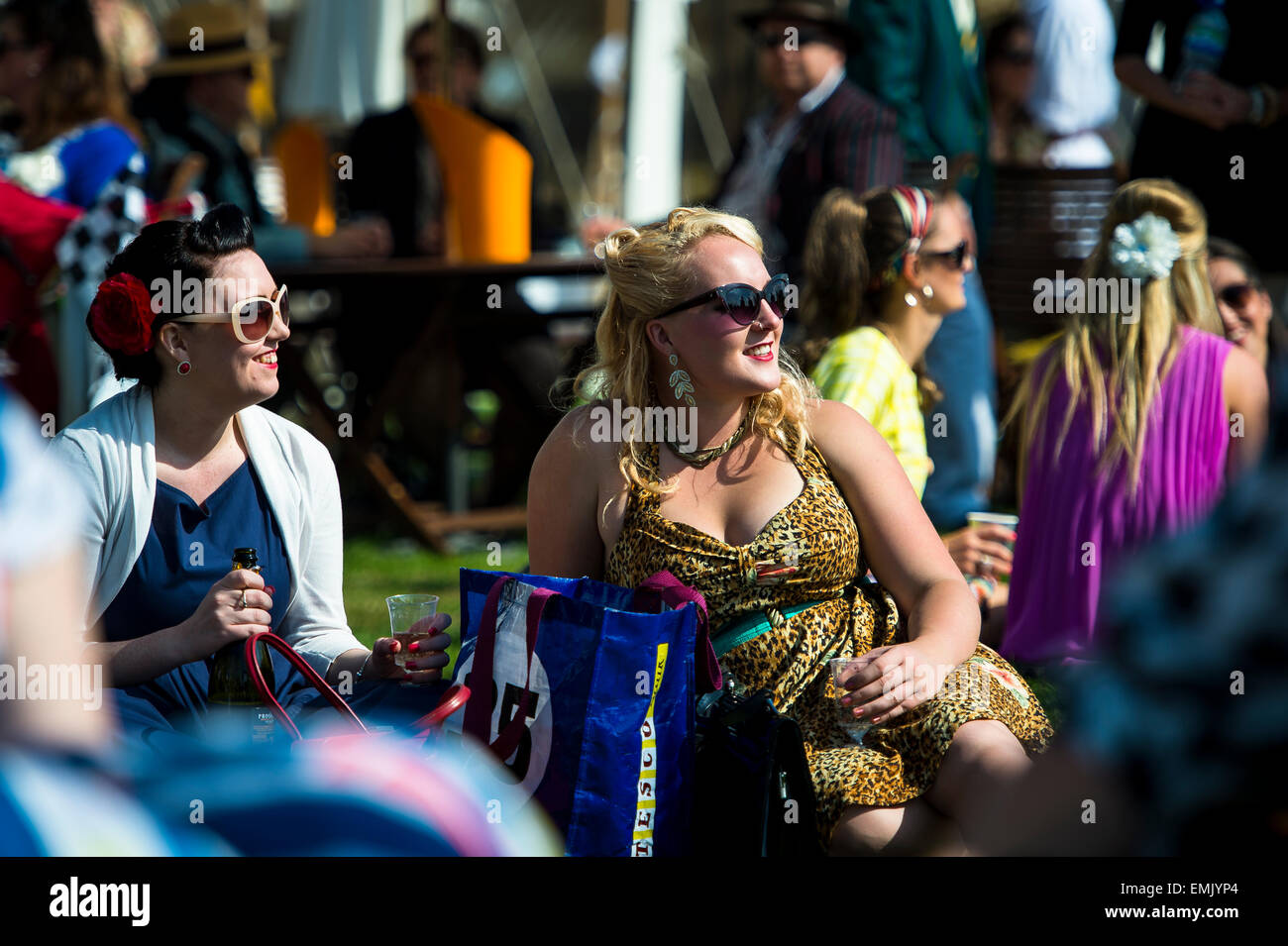 CHICHESTER, ENGLAND - September 12-14, 2014: Historic automobile racing festivities on and off the track for the Goodwood Revival. The Revival celebrates the golden age of motorsport at the Goodwood Motor Circuit, from 1948 to 1966. Stock Photo