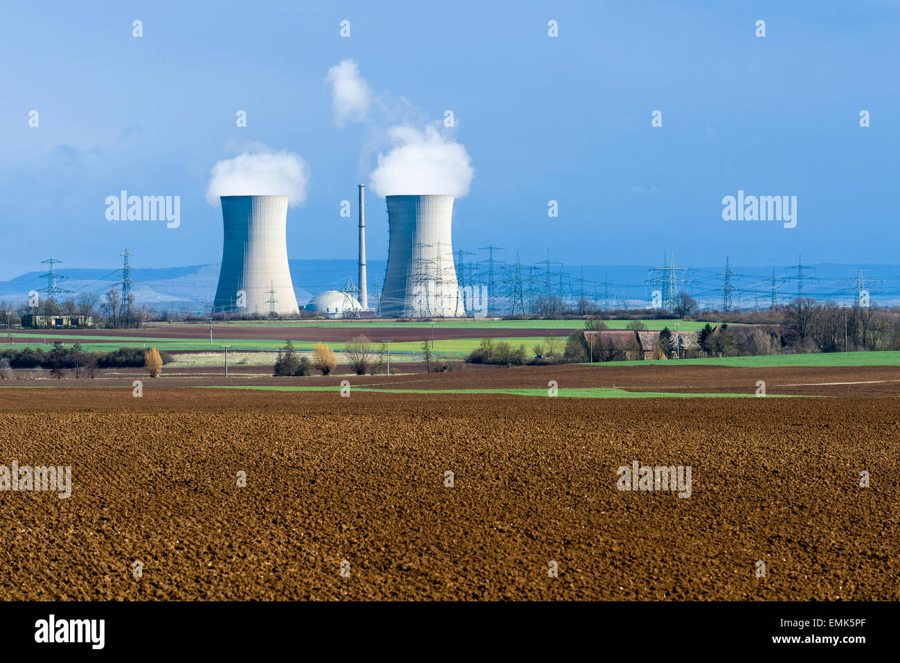 Grafenrheinfeld nuclear power plant, steam coming out of the cooling towers against a dark sky, Grafenrheinfeld, Bavaria Stock Photo