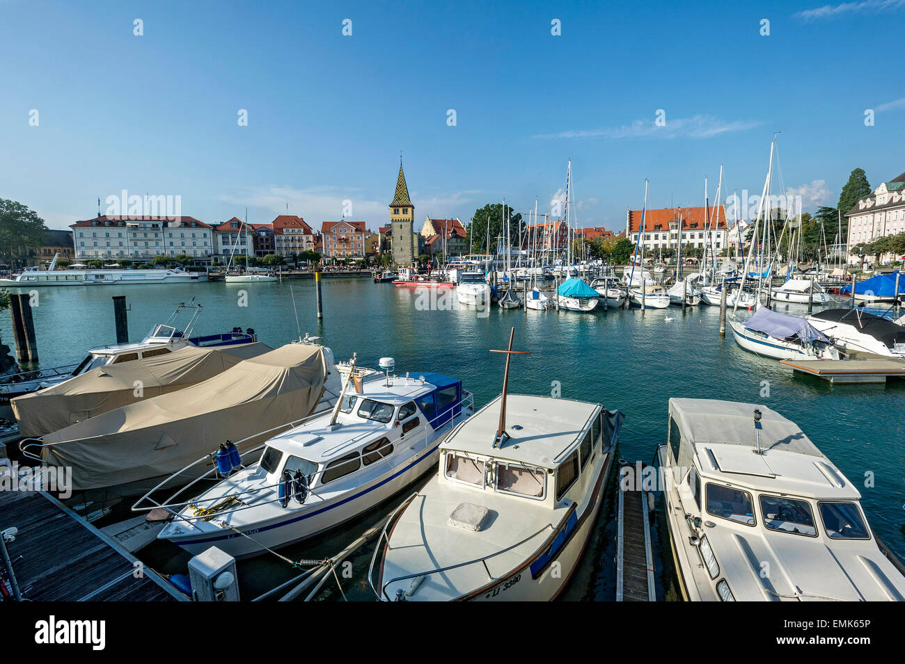 Motor boats and sailing boats, old lighthouse behind, Mangenturm, port, Lake Constance, Lindau, Swabia, Bavaria, Germany Stock Photo