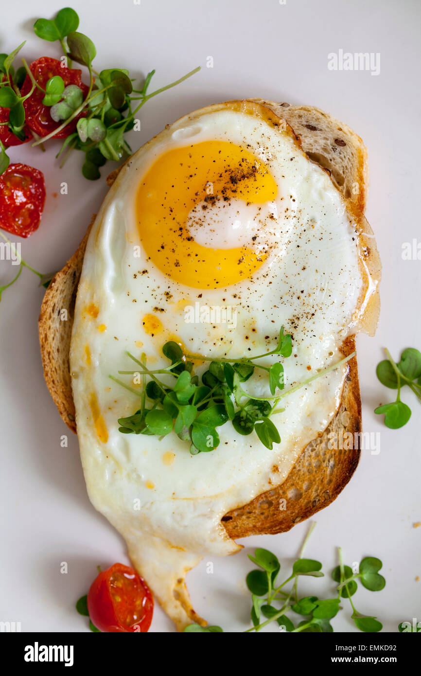 Breakfast, eggs on toast with cherry tomatoes and cress Stock Photo Alamy