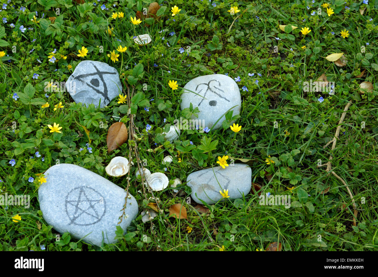 Wicca symbols on pebbles. Stock Photo