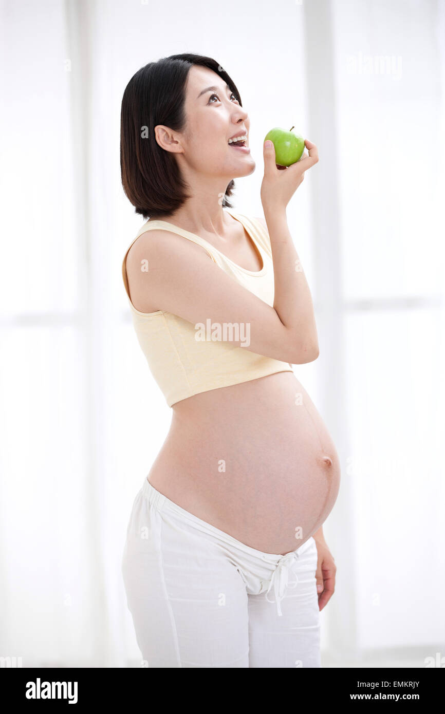 Pregnant women to eat apple Stock Photo Alamy