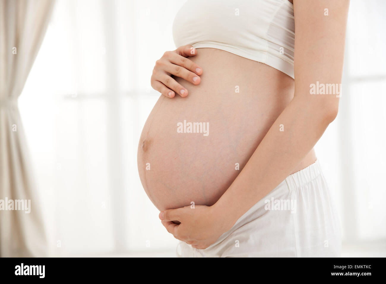 Pregnant Women Stroking Belly Stock Photo Alamy