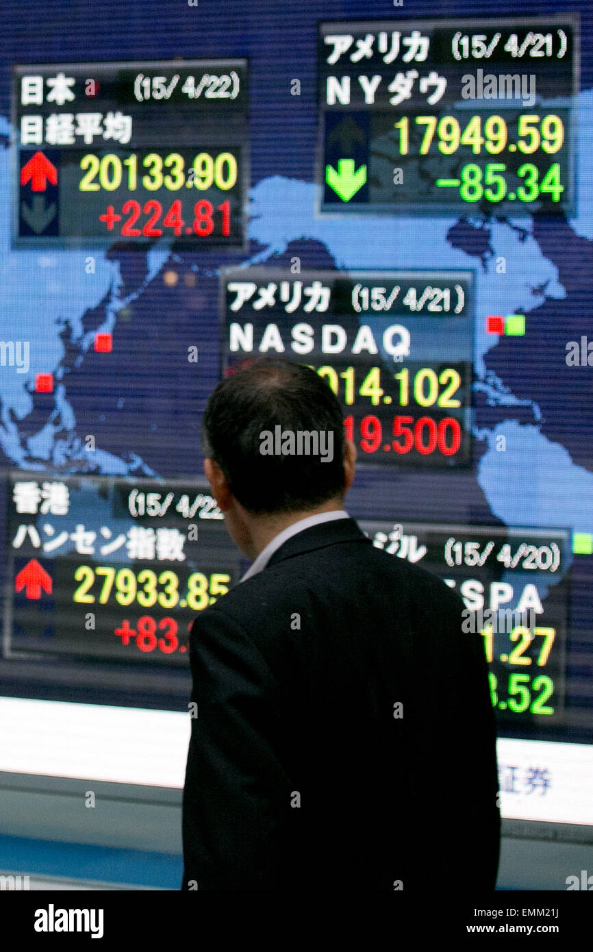Tokyo, Japan. 22nd April, 2015. A man looks at the stock market indicator board on April 22, 2015, Tokyo, Japan. The Japan stock market broke 20,000 yen during the morning trading session of the Tokyo Stock Exchange. Credit:  Rodrigo Reyes Marin/AFLO/Alamy Live News Stock Photo