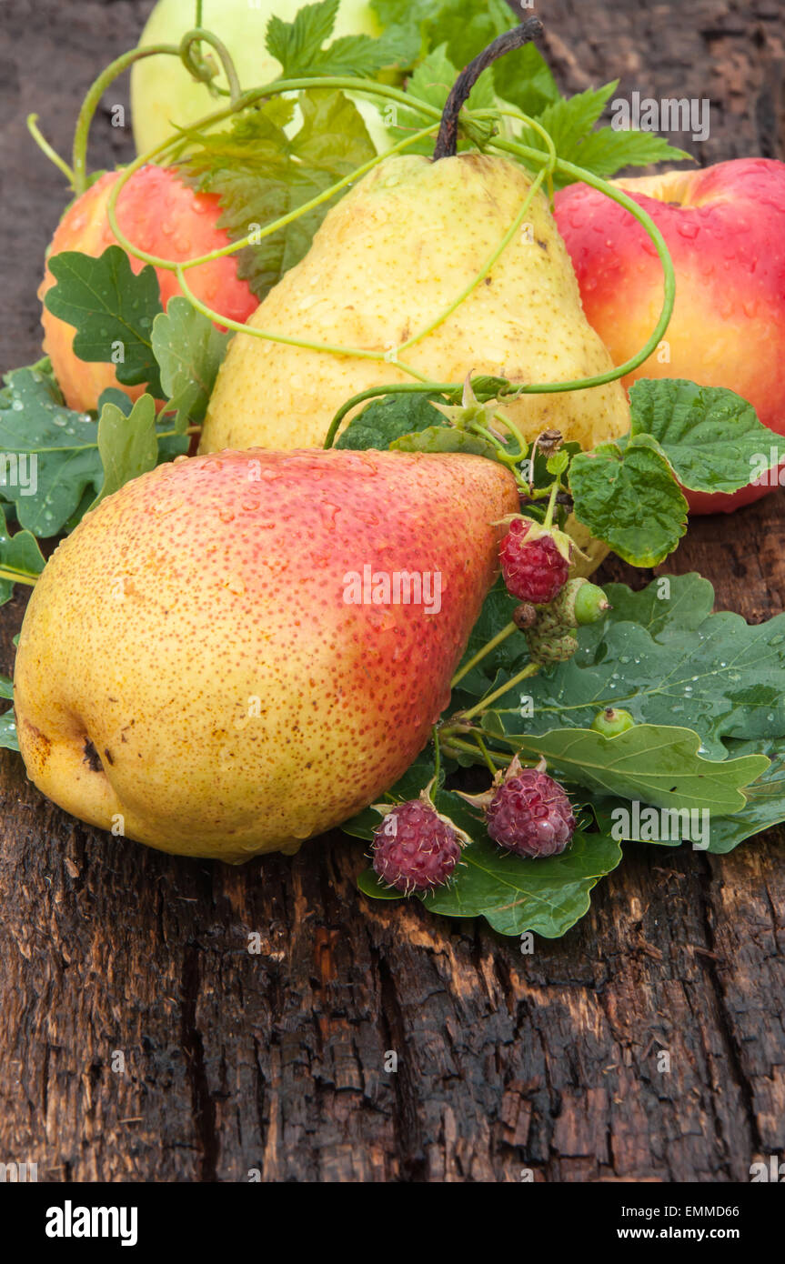 Ripe pear and berry raspberry on wood countertop Stock Photo - Alamy