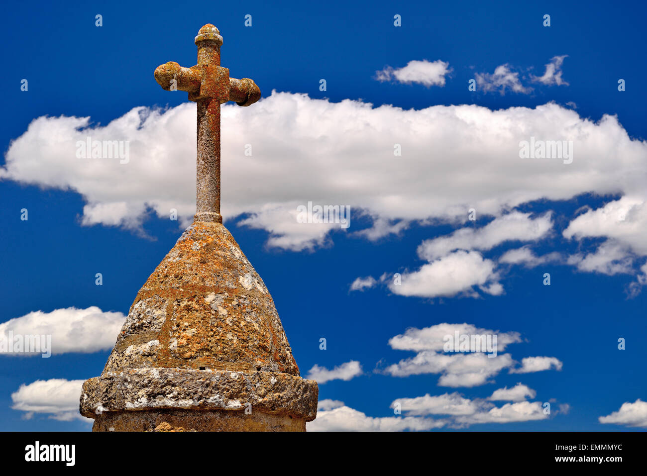 Spain, St. James Way: Romanesque  stone cross with fair weather clouds Stock Photo