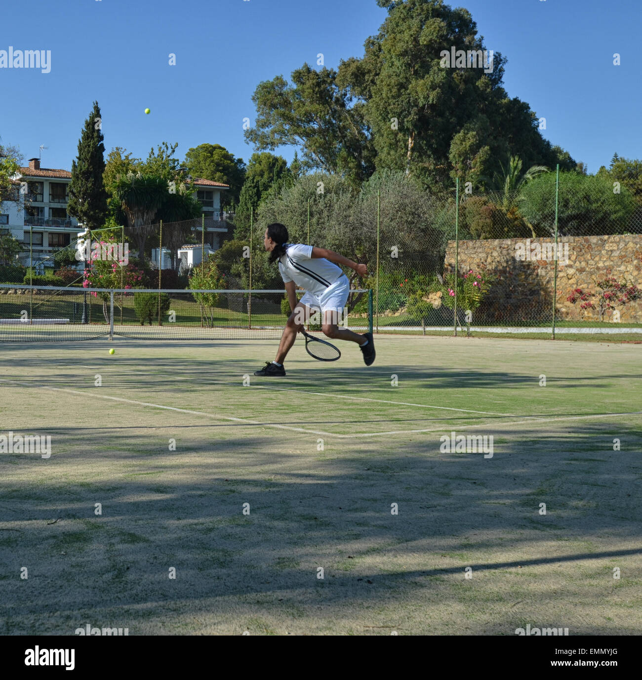 Recovering a ball in a tennis match Stock Photo Alamy