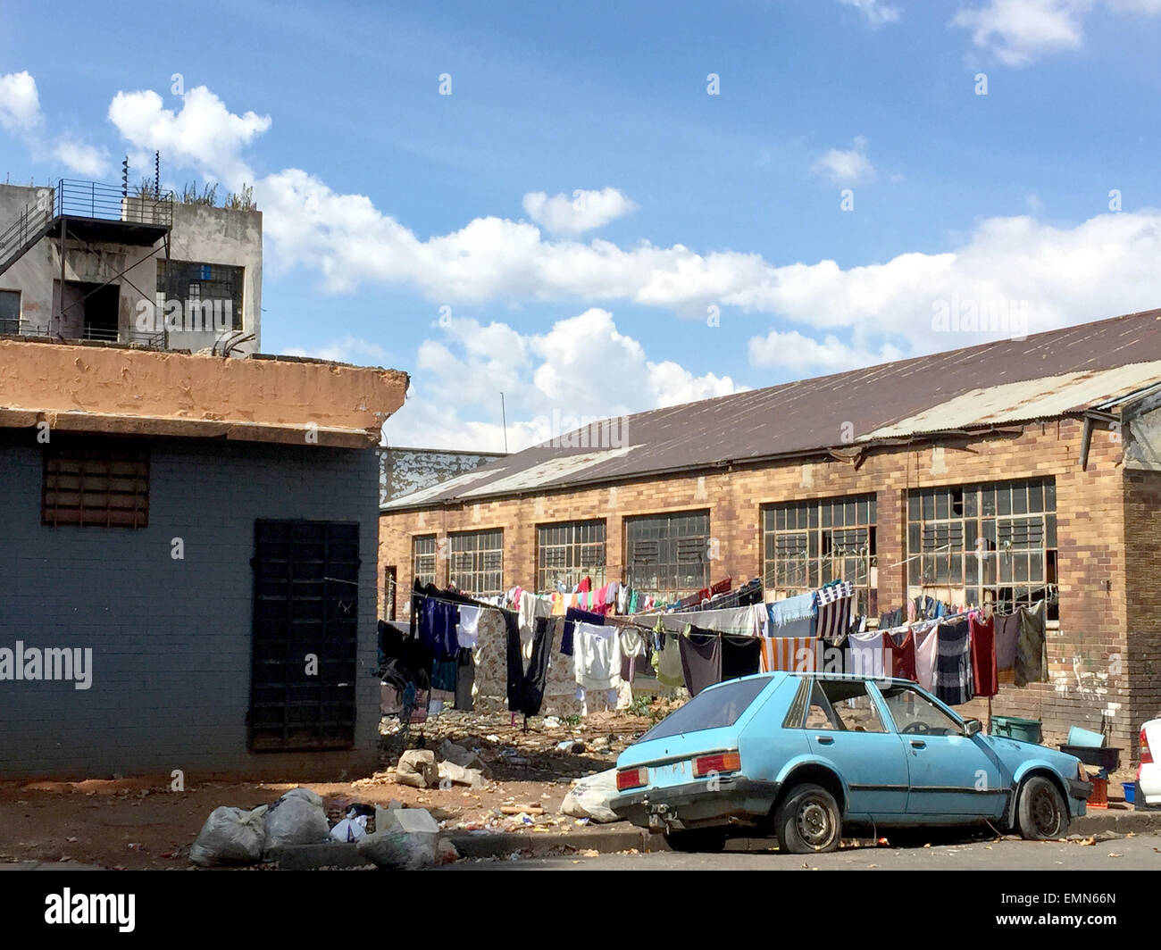 Johannesburg, South Africa. 21st Apr, 2015. Laundry hangs in the back courtyard of the Jeppestown workers' home in the center of Johannesburg, South Africa, 21 April 2015. The 1,500-resident home, originally founded for mine workers, was one of the starting points for the xenophobic riots of the past weeks. Dozens of immigrant-owned shops were looted. Photo: JUERGEN BAETZ/dpa/Alamy Live News Stock Photo