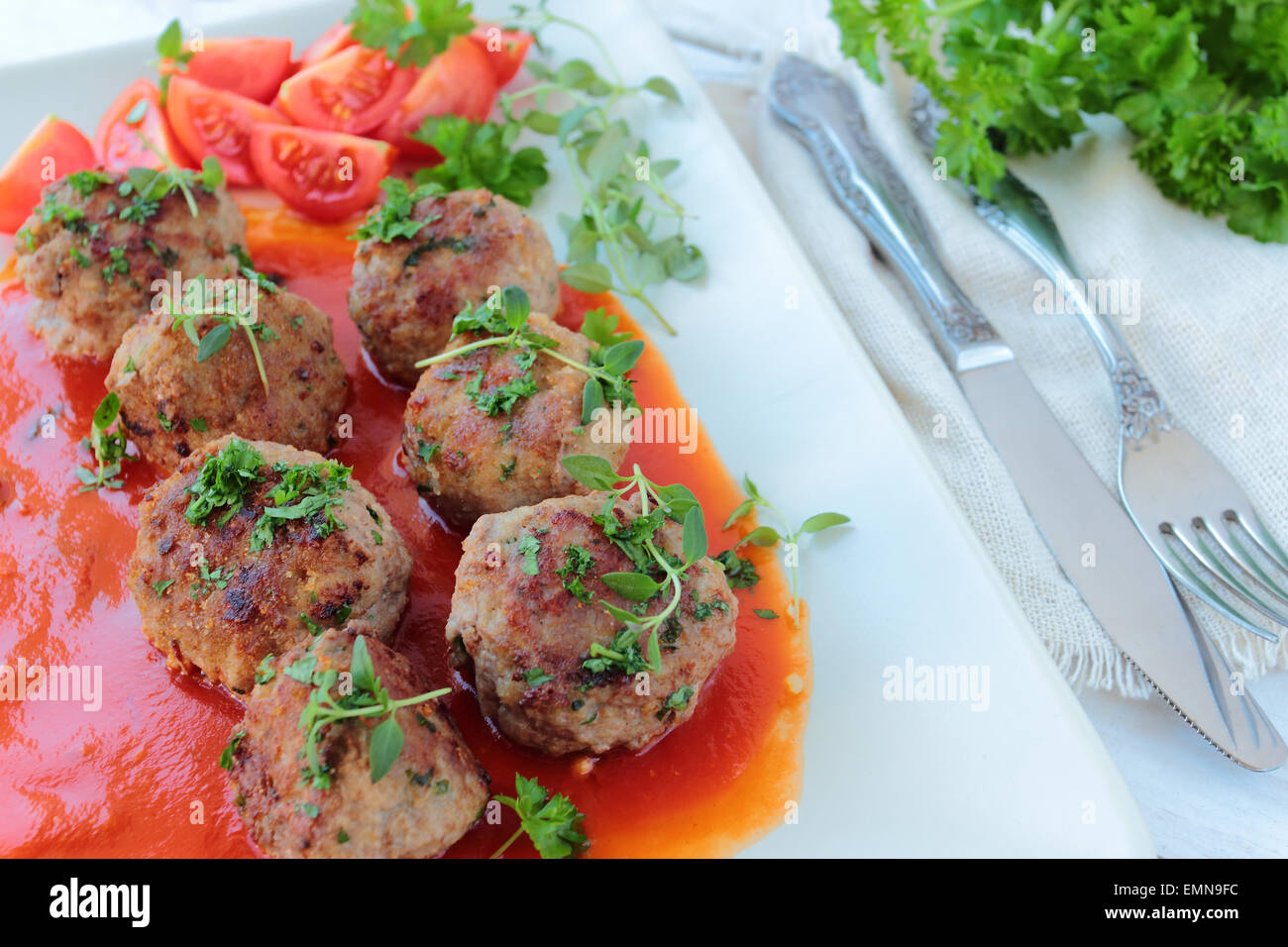 Meatballs with fresh parsley and thyme twigs Stock Photo Alamy