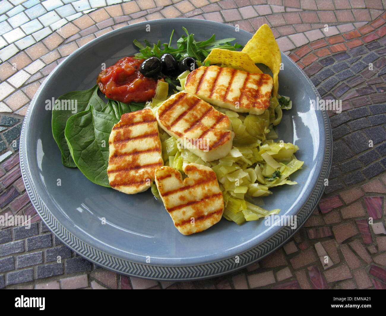 Grilled Halloumi with leeks and salad Stock Photo