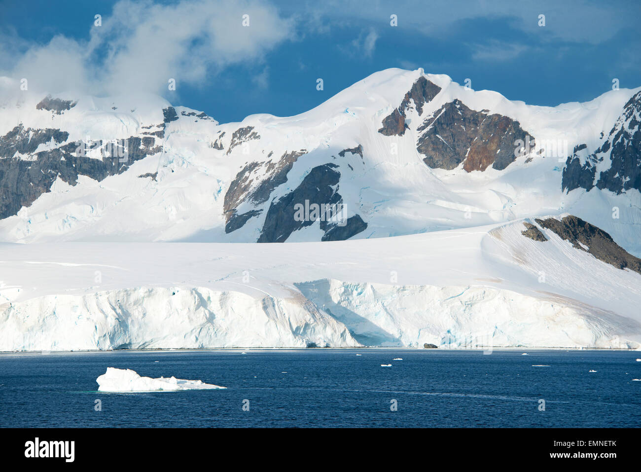 Small iceberg and snowcapped mountains Lemaire Channel Antarctic ...