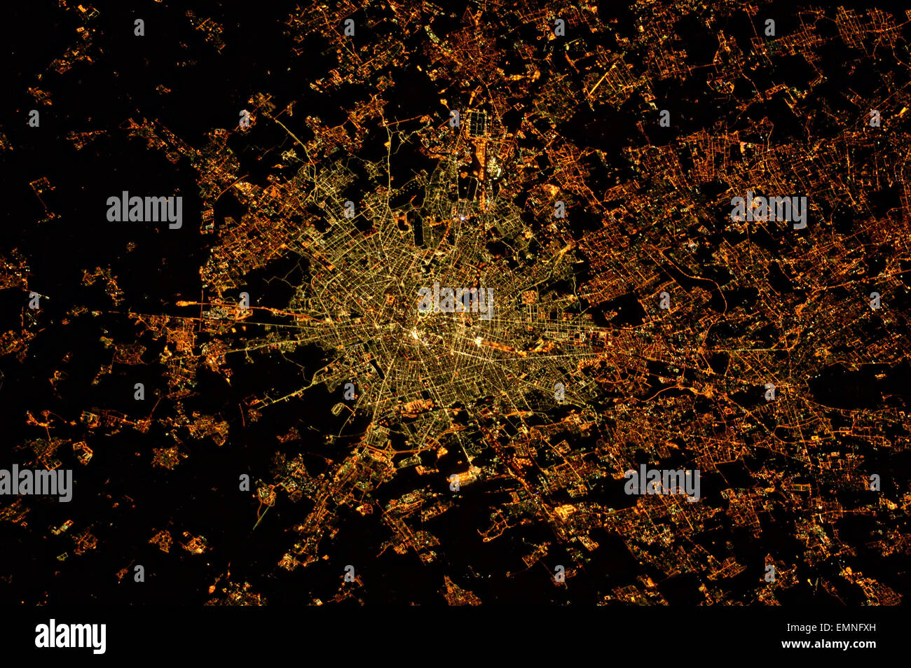 View from the International Space Station at night of the lights of Milan, Italy. Stock Photo