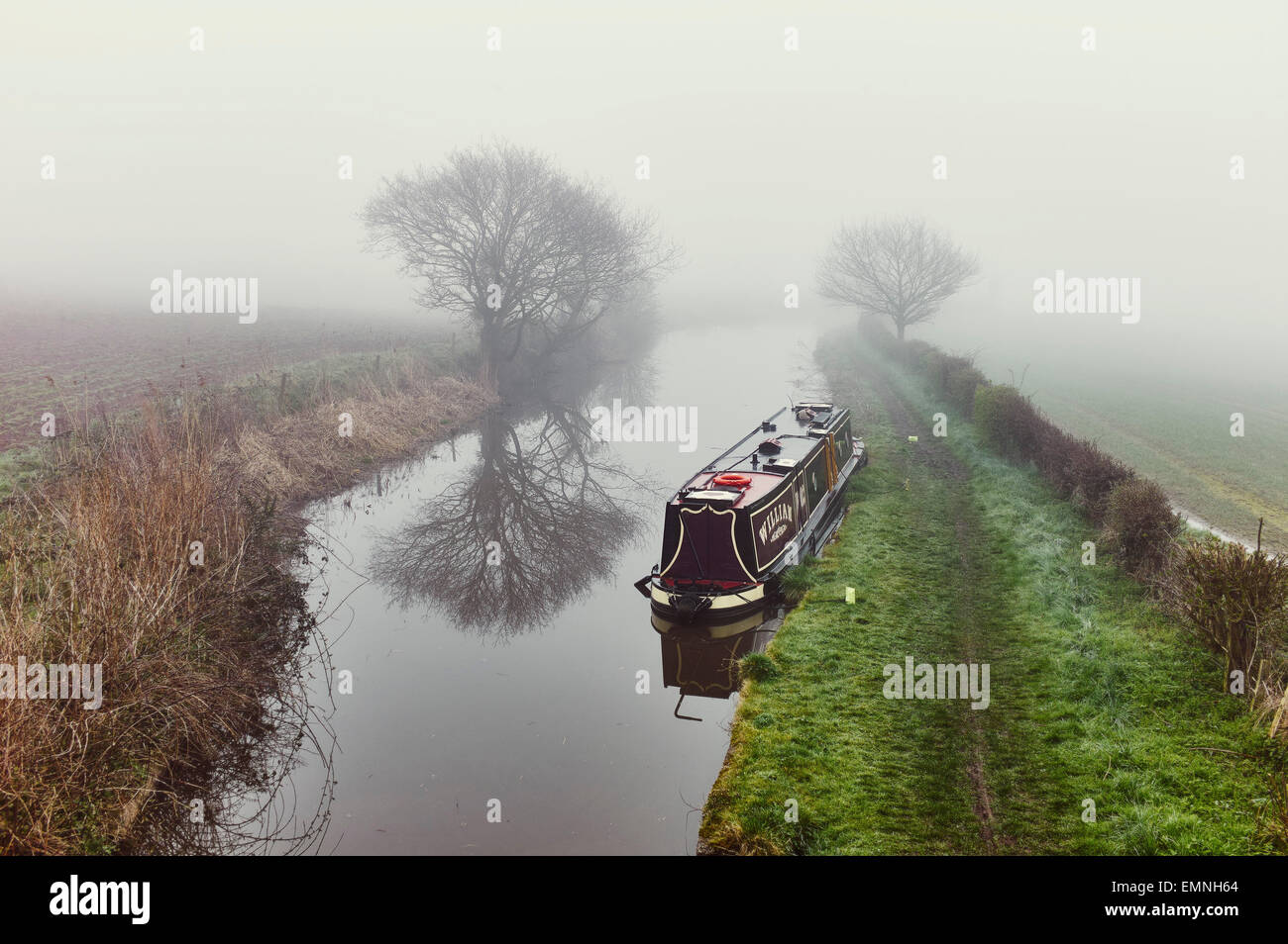 Narrowboat William moored on a misty morning on the Trent and Mersey Canal Stock Photo