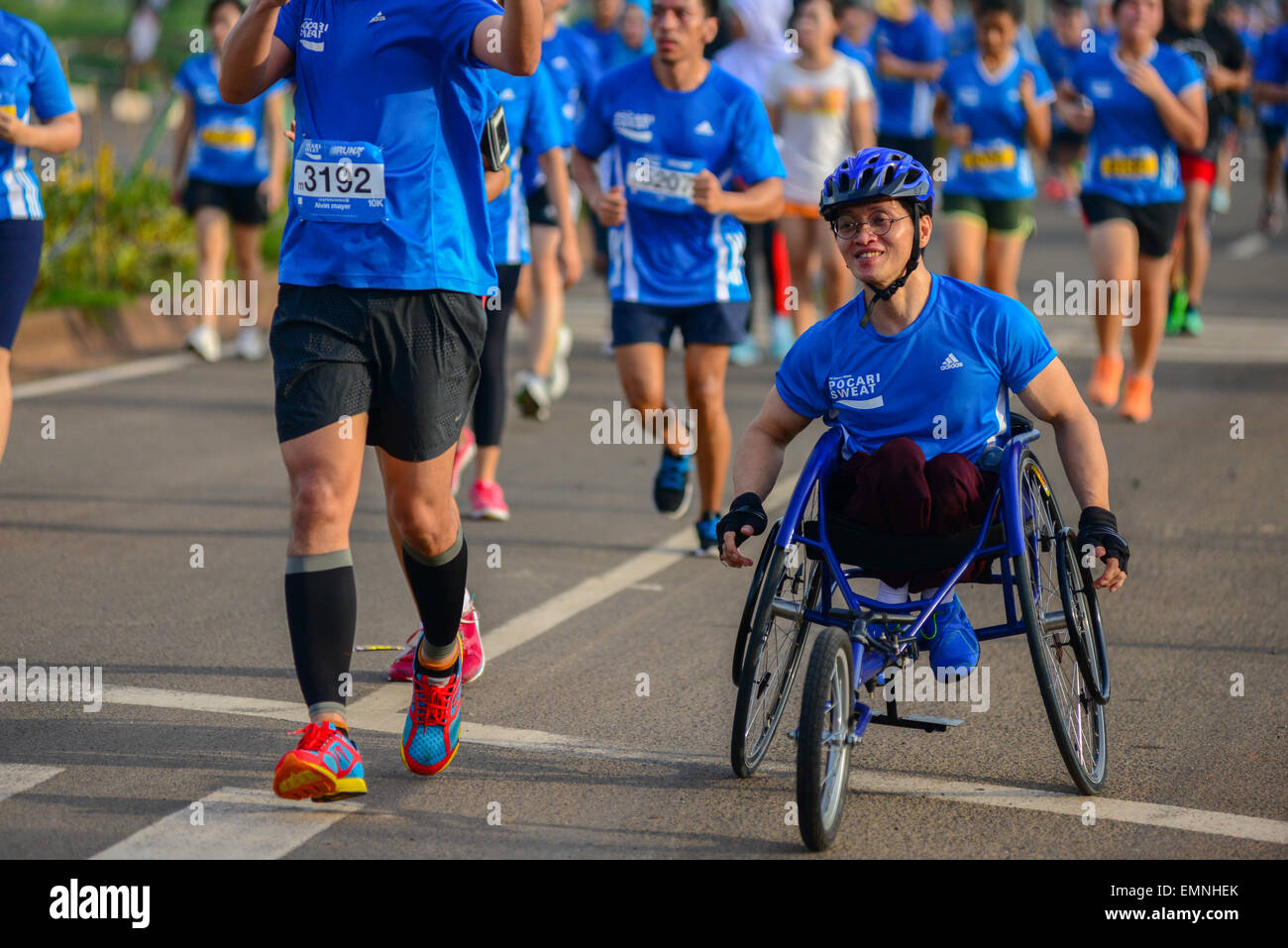 Participants running during  'Pocari Sweat Run Indonesia 2015' in Tangerang, Banten, Indonesia. Stock Photo