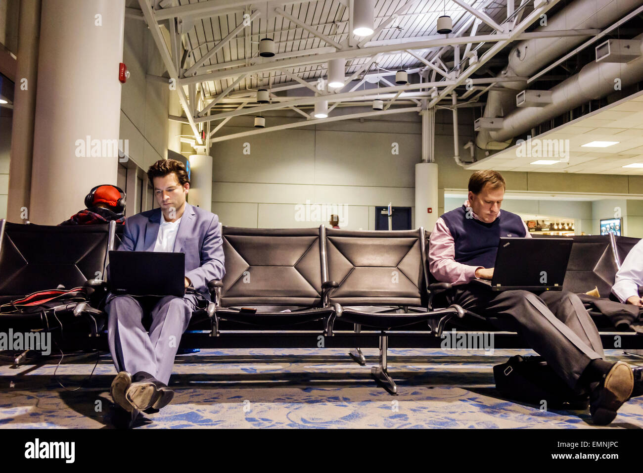 North Carolina,South,Charlotte,Charlotte Douglas International Airport,CLT,terminal,gate,man men male,laptop,using,NC150225021 Stock Photo