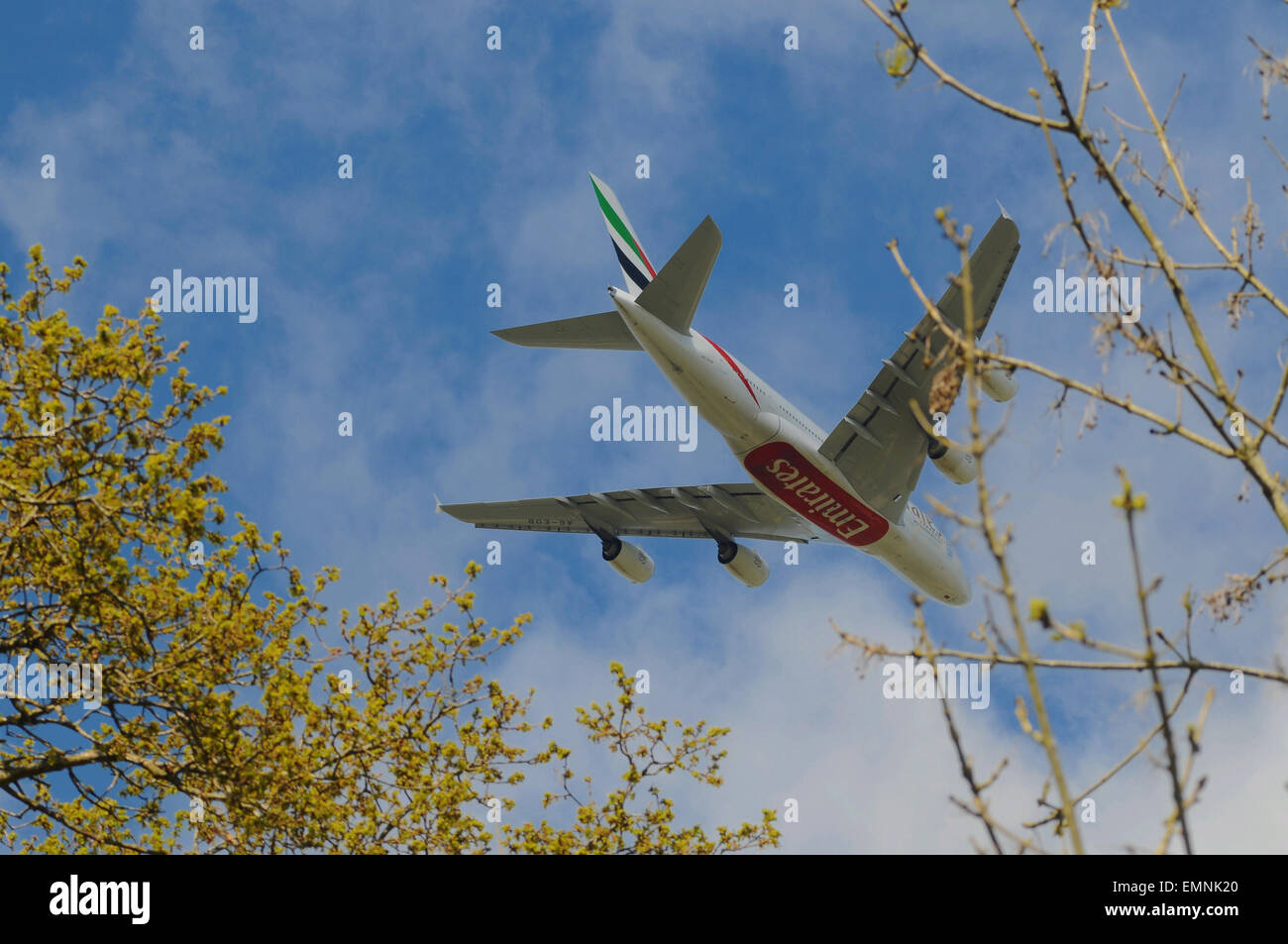 Burstow, Surrey, UK. 22nd April, 2015. Gatwick Airport second runway debate continues. Emirates Airbus 380 takes off over the countryside. Aircraft now being larger with more efficient quieter engines the impact on the environment seems less than previously. This giant was certainly quieter than the smaller jets taking off Stock Photo