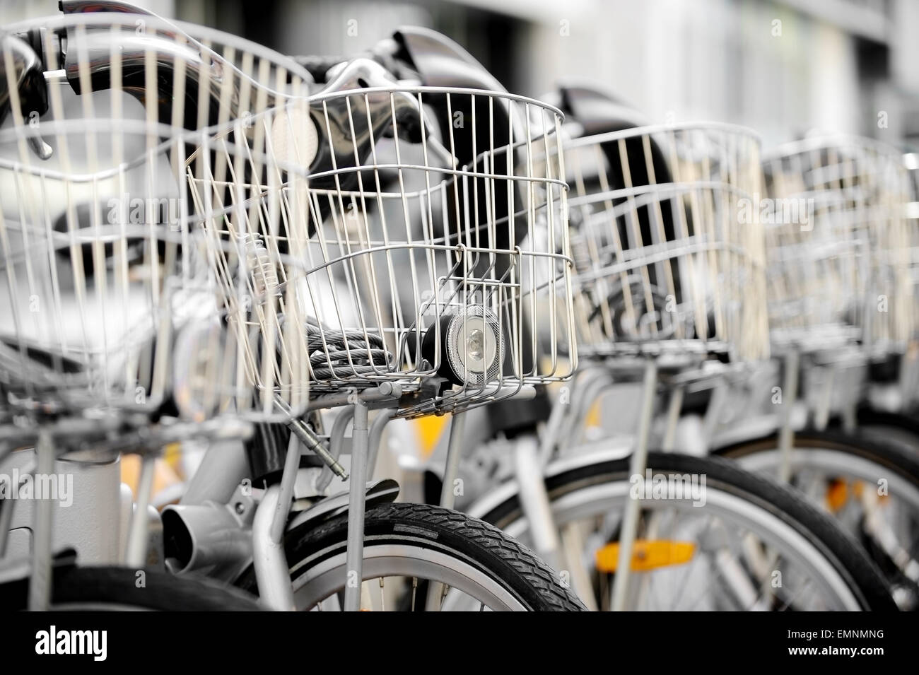 City bicycles with front basket are seen in a rental station Stock Photo