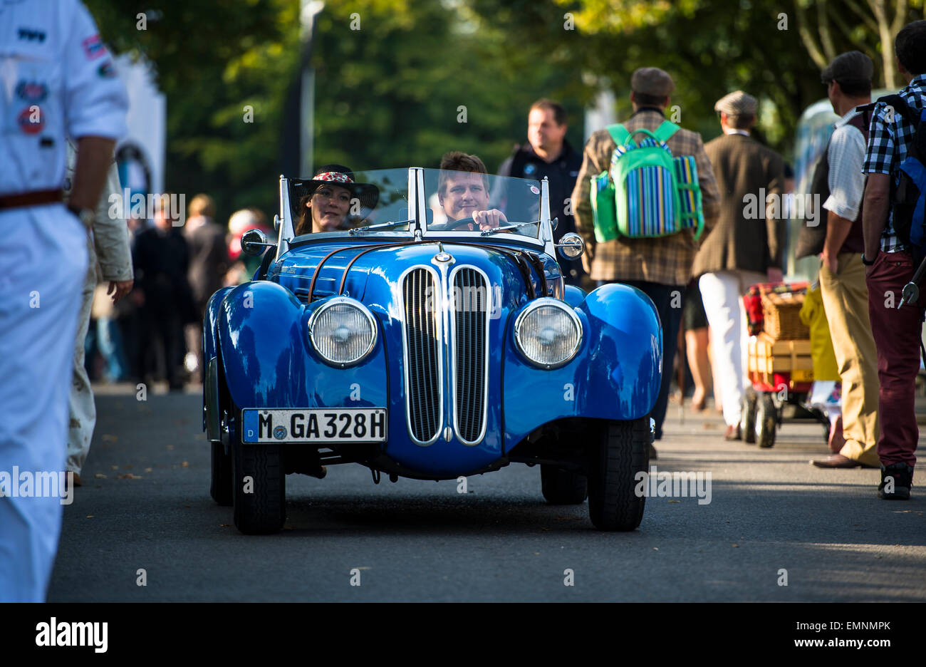 CHICHESTER, ENGLAND - September 12-14, 2014: Historic automobile racing festivities on and off the track for the Goodwood Revival. The Revival celebrates the golden age of motorsport at the Goodwood Motor Circuit, from 1948 to 1966. Stock Photo
