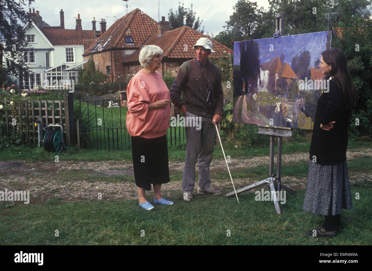 Elizabeth Jane Howard  author in her garden Bungay Suffolk UK with blind artist Sargy Mann and his wife. 1990s 1996 HOMER SYKES Stock Photo