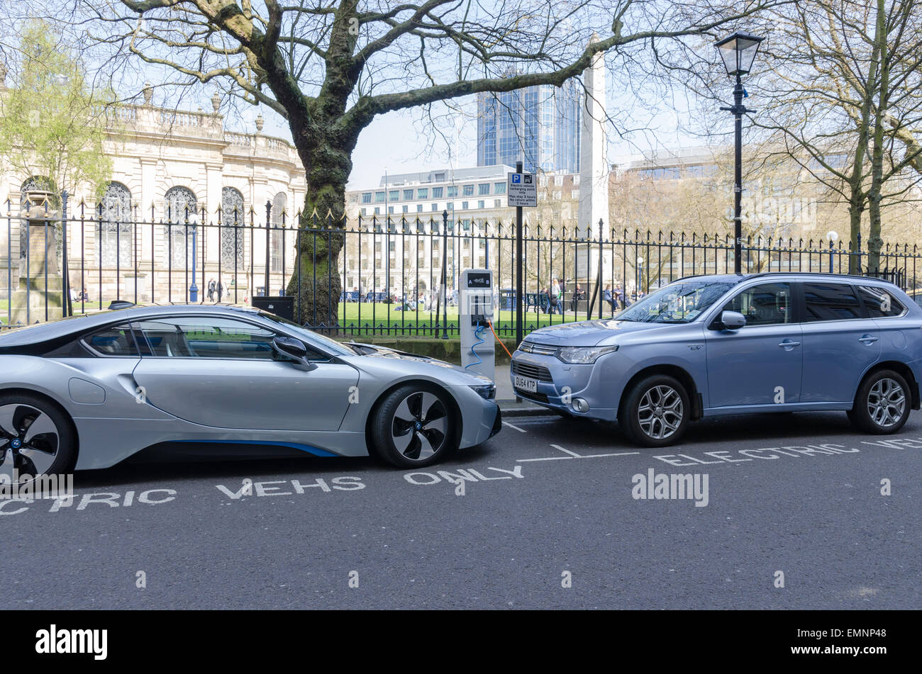 Electric cars charging in Birmingham City Centre Stock Photo