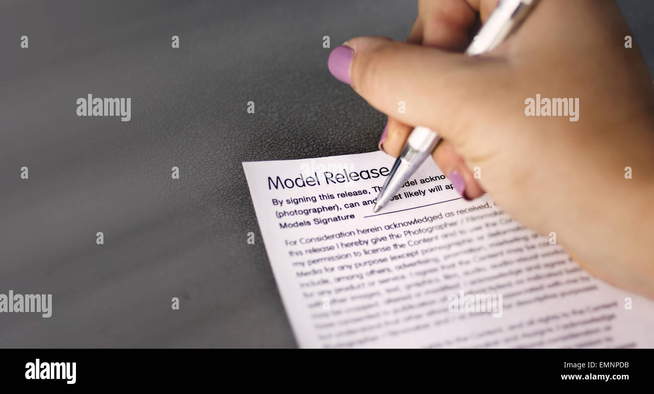 Model signing release form with pen Stock Photo