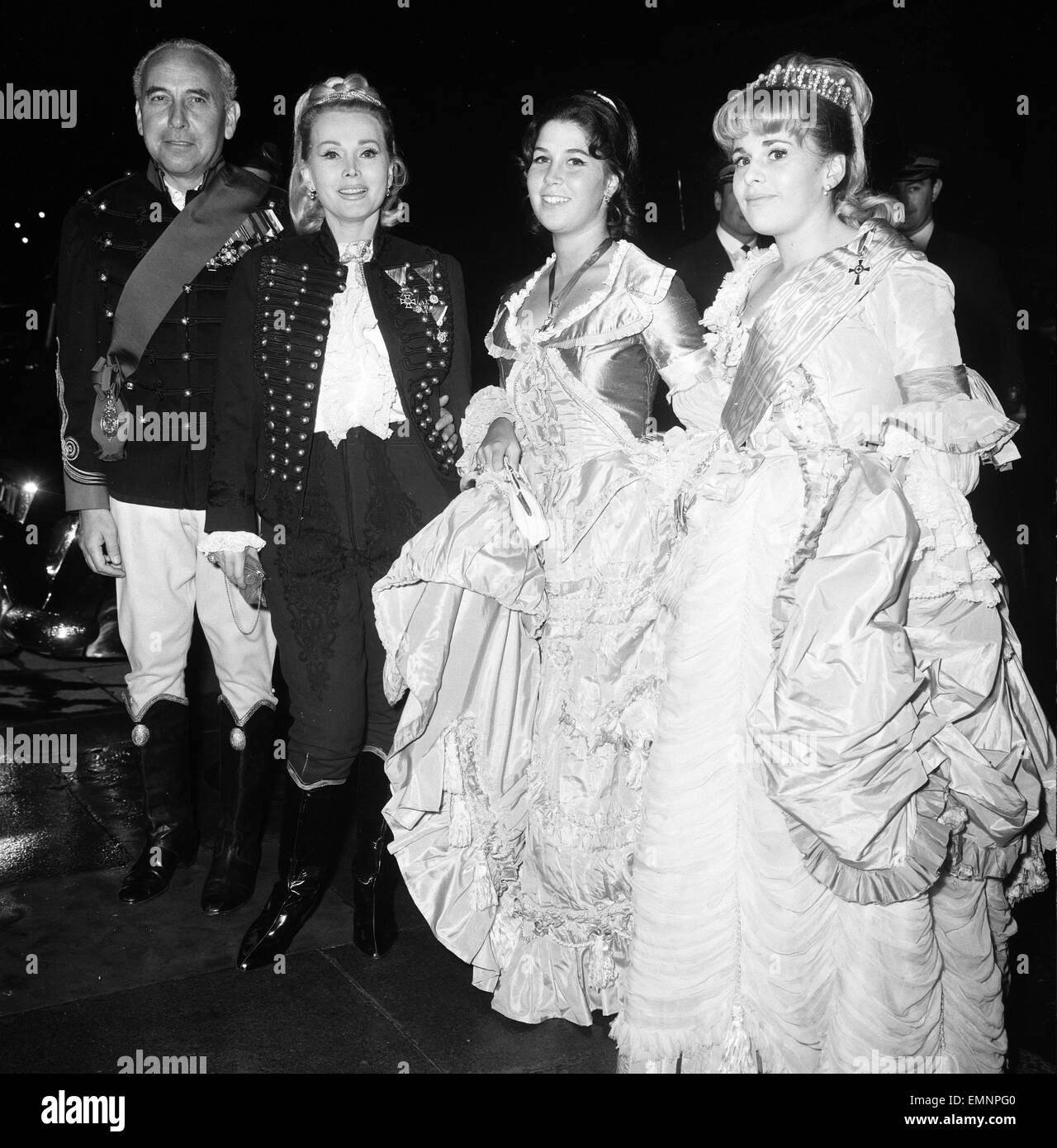 Actress Zsa Zsa Gabor holds a party this evening for over 200 guests at Les Ambassadeurs Club, Hamilton Place, London 9th July 1964. Pictured dressed in Hussar Uniform. Also pictured: husband Herbert Hunter & daughter Constance Hilton a.k.a. Francesca Hilton. Stock Photo