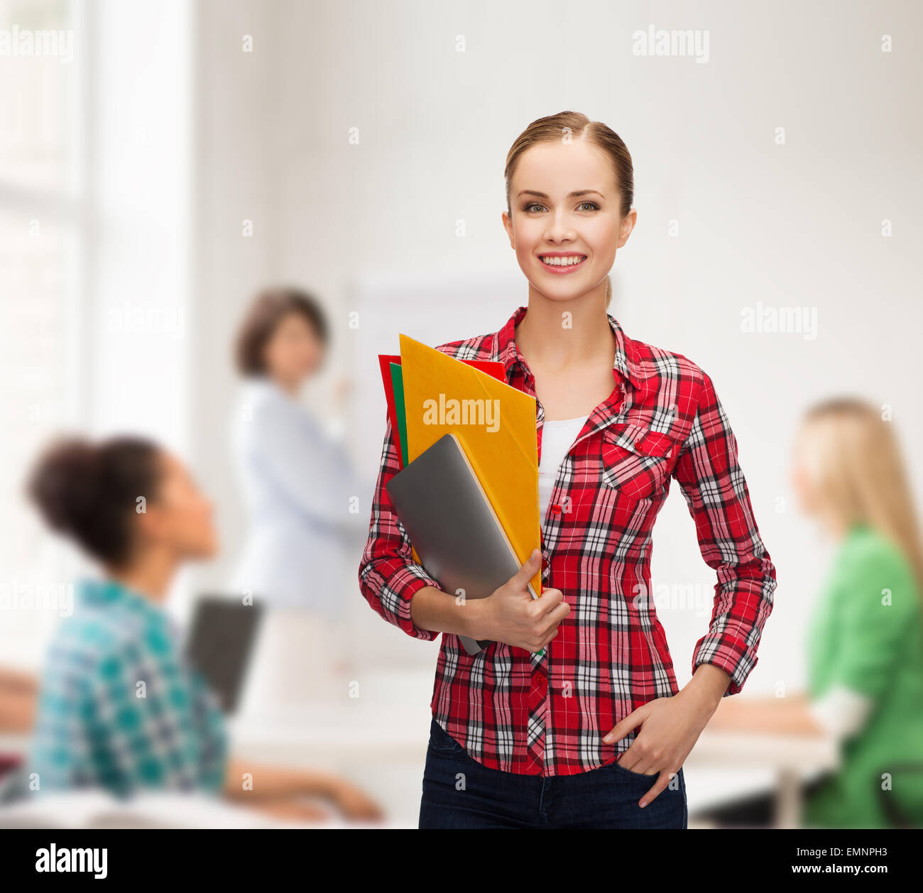 smiling student with folders and tablet pc Stock Photo - Alamy