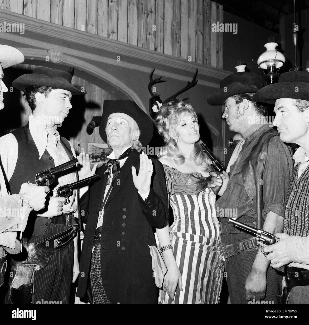 Actors rehearse for new Dr Who Story - The Gunfighters - at BBC Television Centre London 22nd April 1966. Pictured: William Hartnell - the first doctor & Sheena Marsh who plays Kate, pictured in a hold up scene in a Western Saloon Bar. Stock Photo