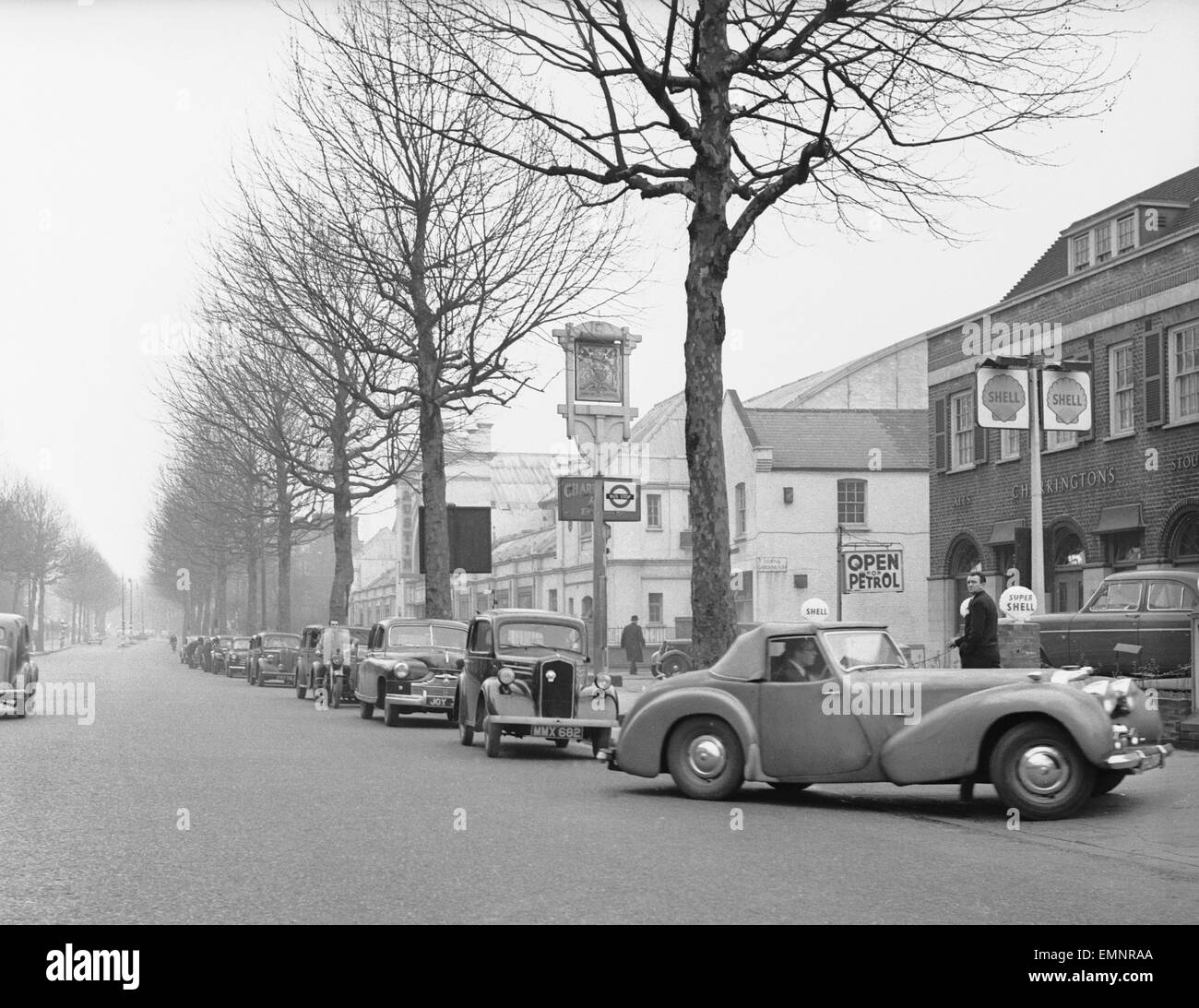 Cars queuing for petrol Black and White Stock Photos & Images Alamy