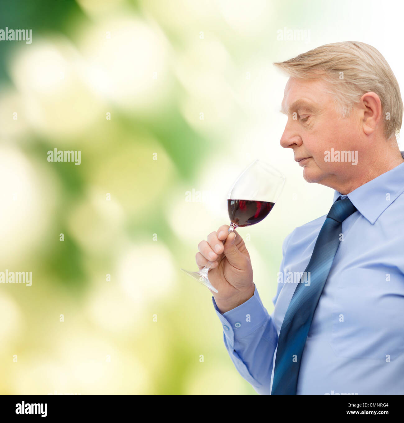 elderly man smelling red wine Stock Photo - Alamy