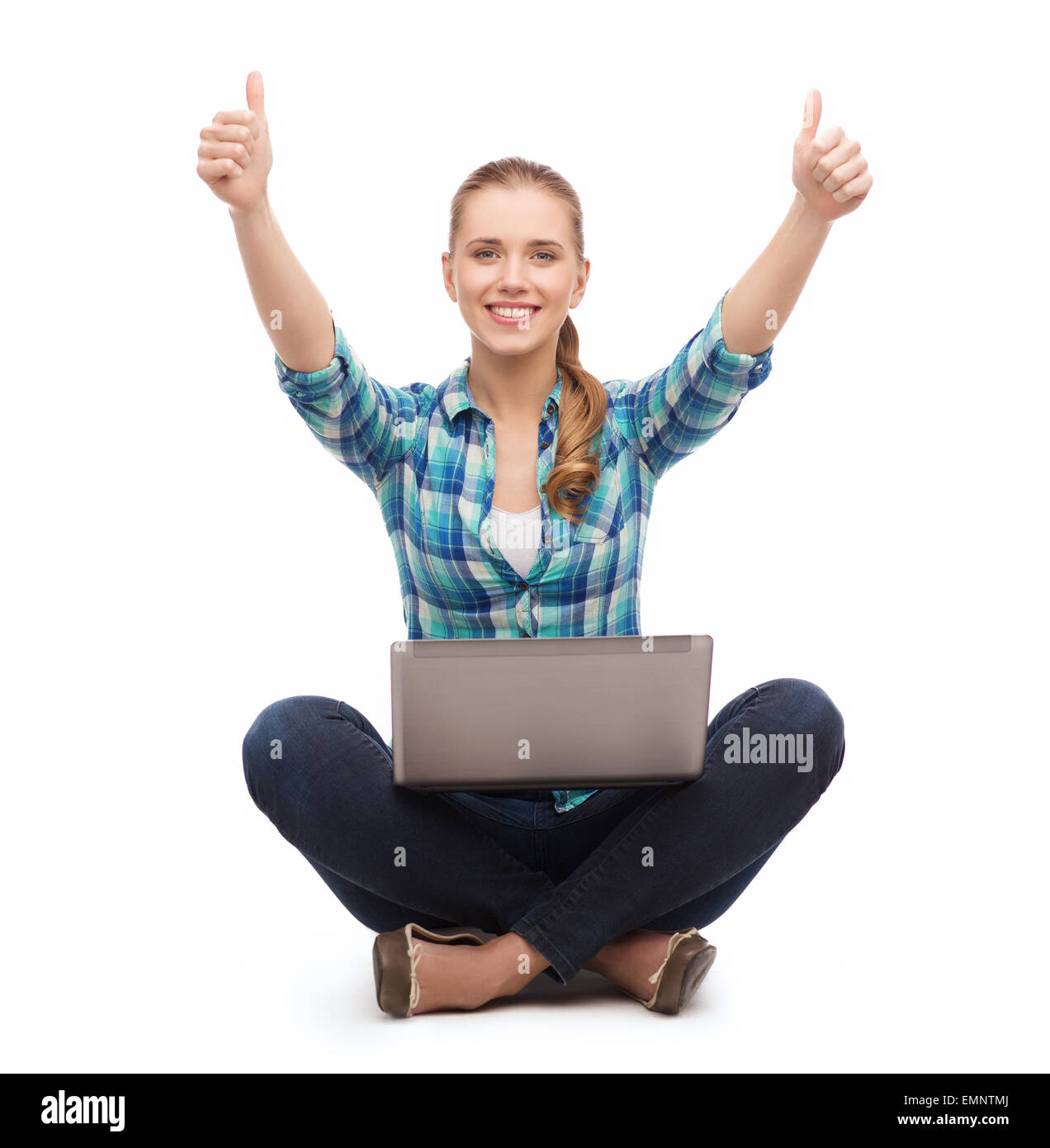 smiling woman with laptop and showing thumbs up Stock Photo - Alamy