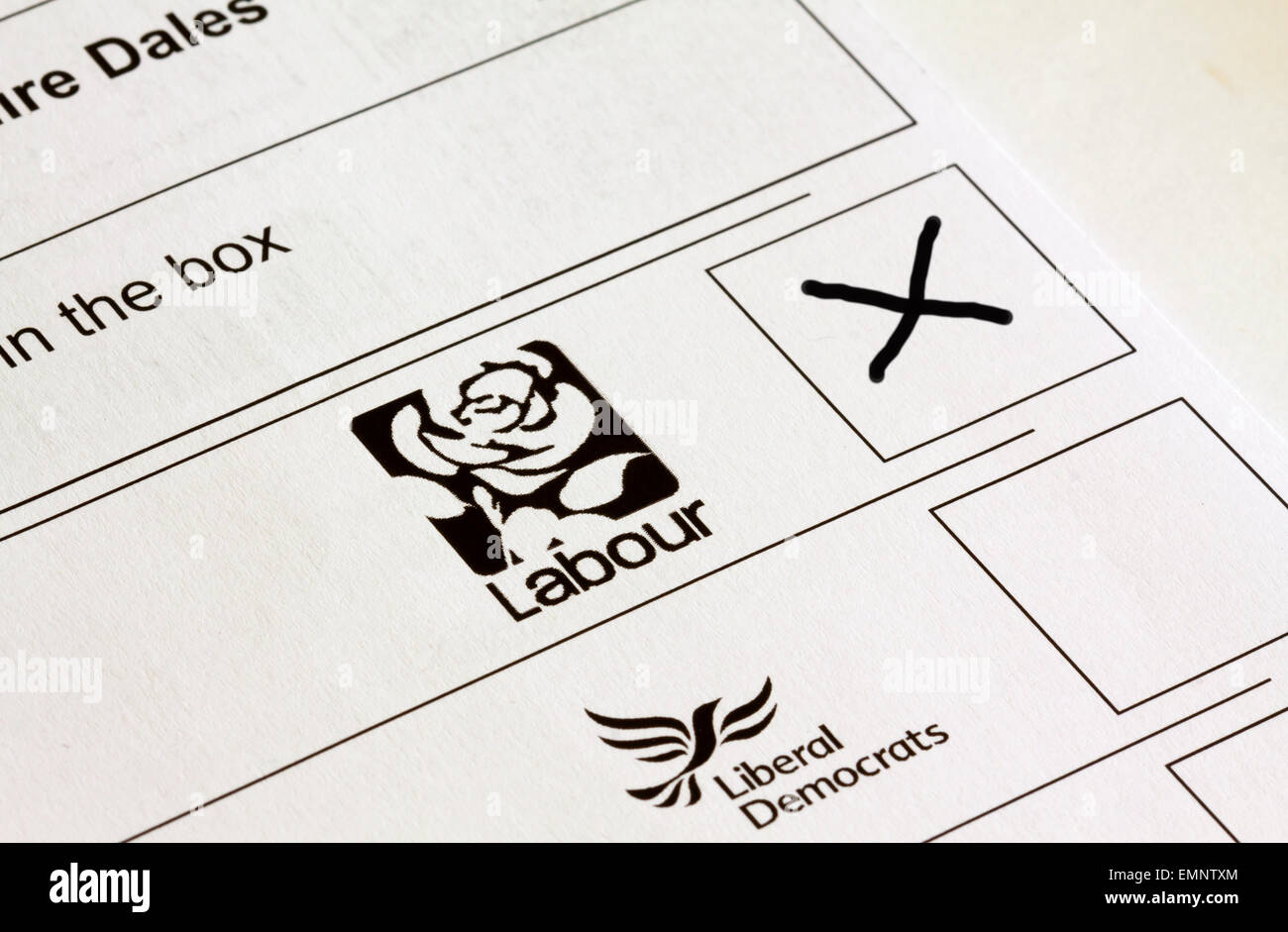 UK General Election ballot paper with boxes marked for voting for different political party candidates with Labour cross in box Stock Photo