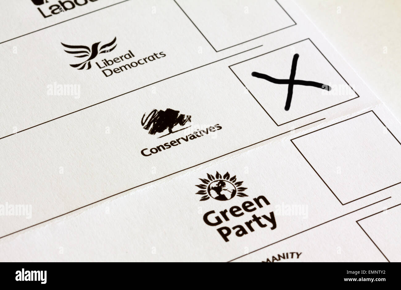 UK General Election ballot paper with boxes marked for voting for different political party candidates with Conservative cross Stock Photo