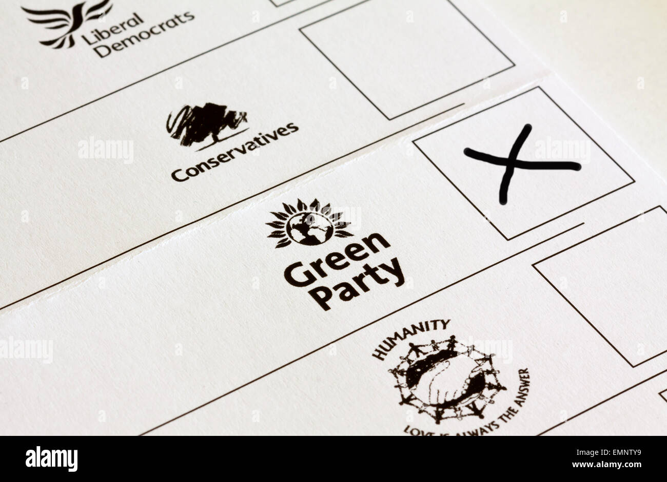 UK General Election ballot paper with boxes marked for voting for different political party candidates with Green Party cross Stock Photo