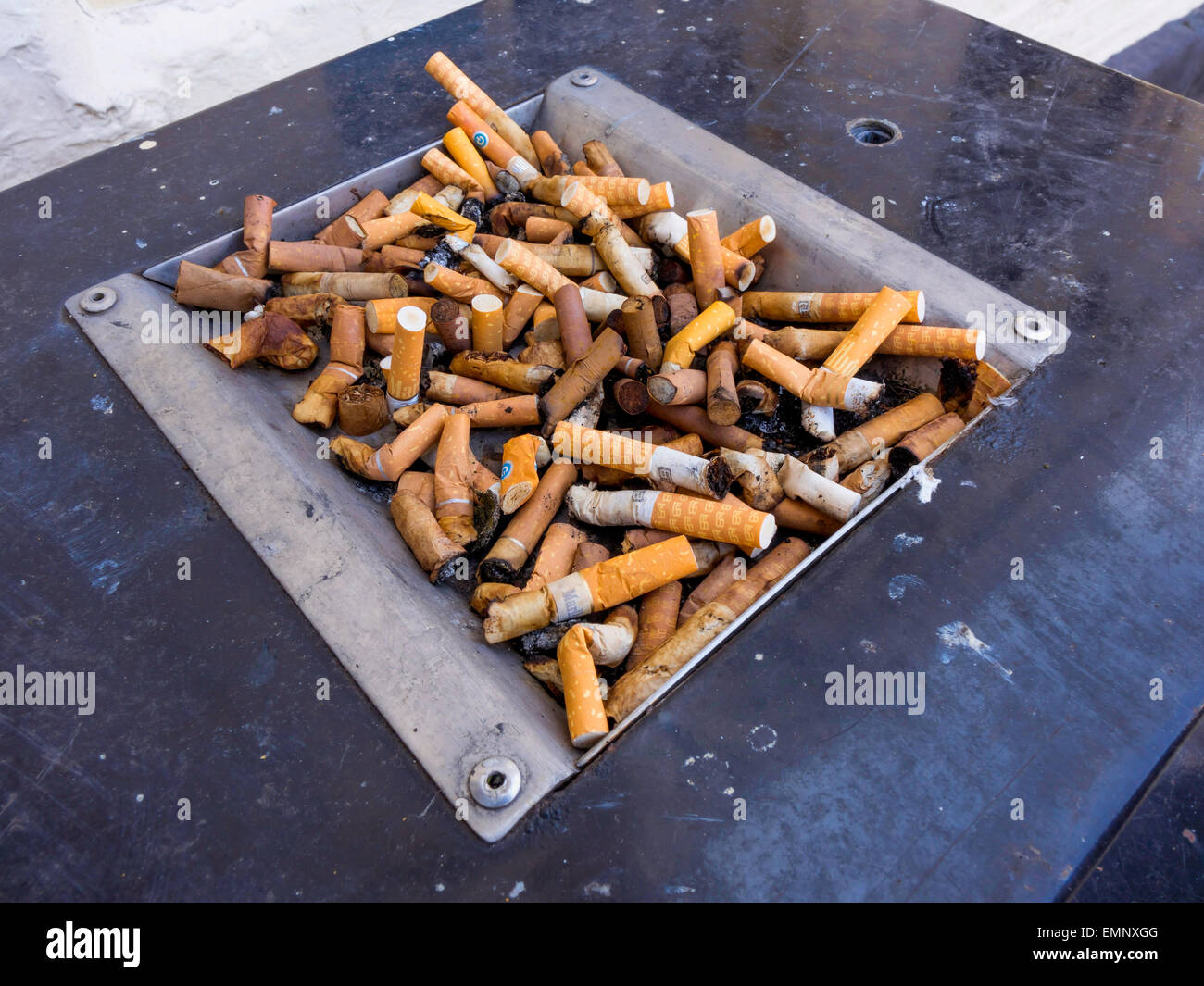 Litter Bin top with cigarette end disposal full Stock Photo
