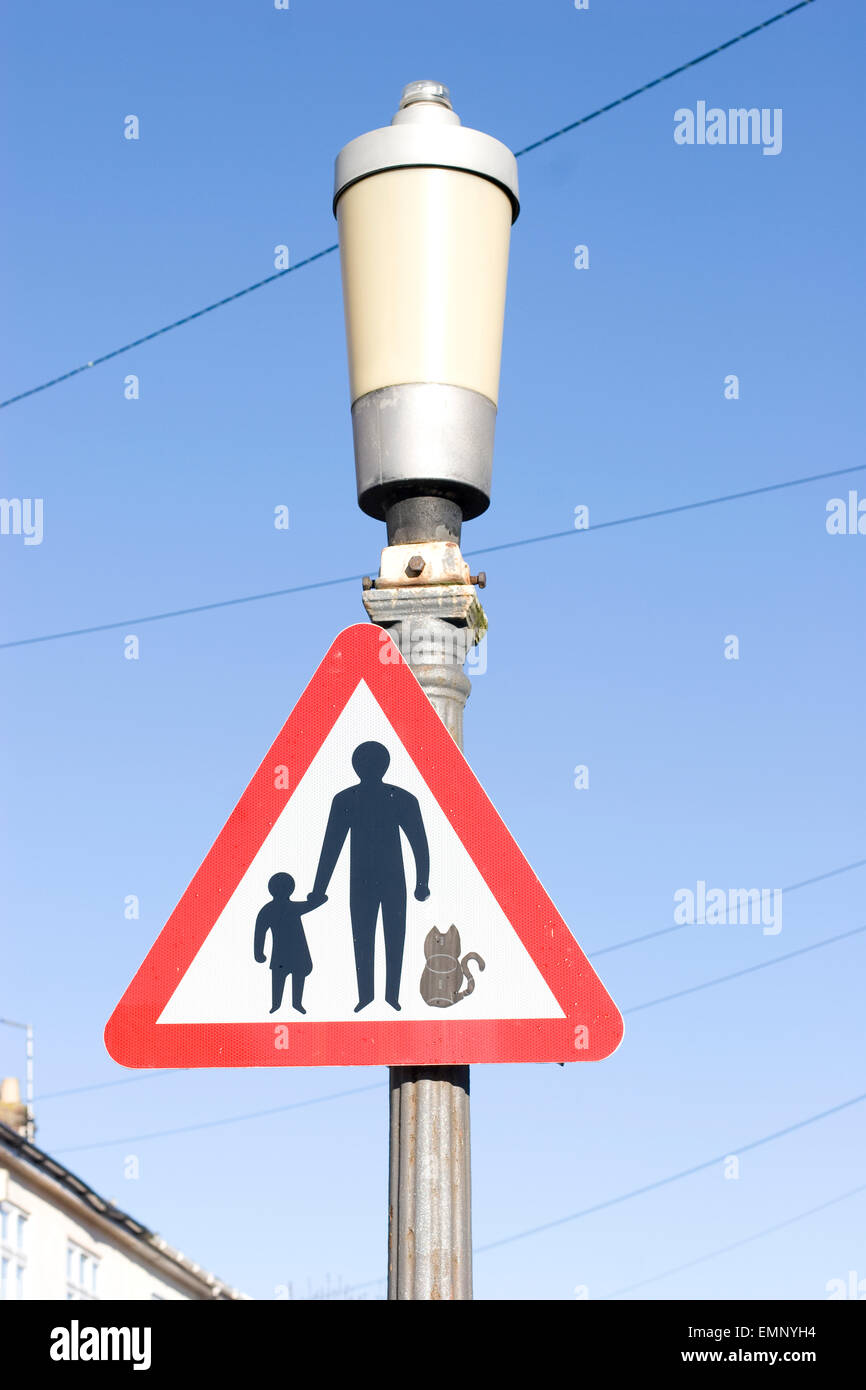 Parent and child - and cat - road sign, which warns drivers of pedestrians and cats in the road ahead, Bristol Stock Photo
