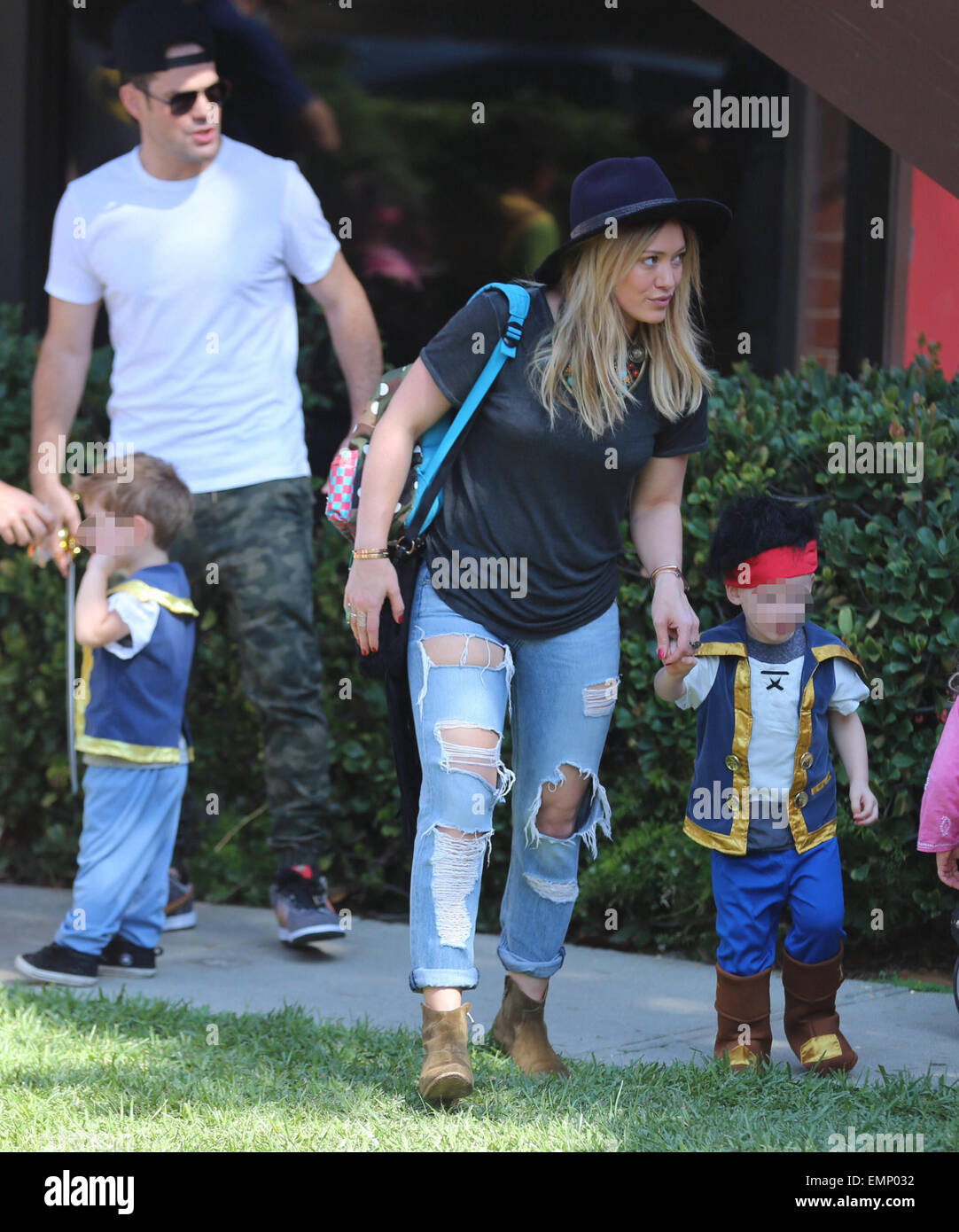 Hilary Duff, Mike Comrie, and their son Luca Comrie arrive at Luca's