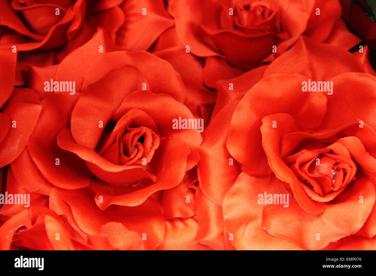red rose silk flower background Stock Photo - Alamy