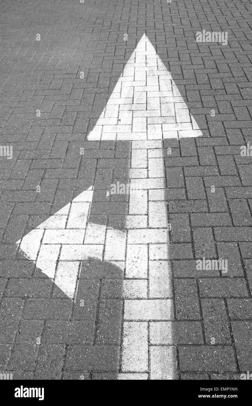 White arrows on a paved surface, 22nd April 2015 Stock Photo