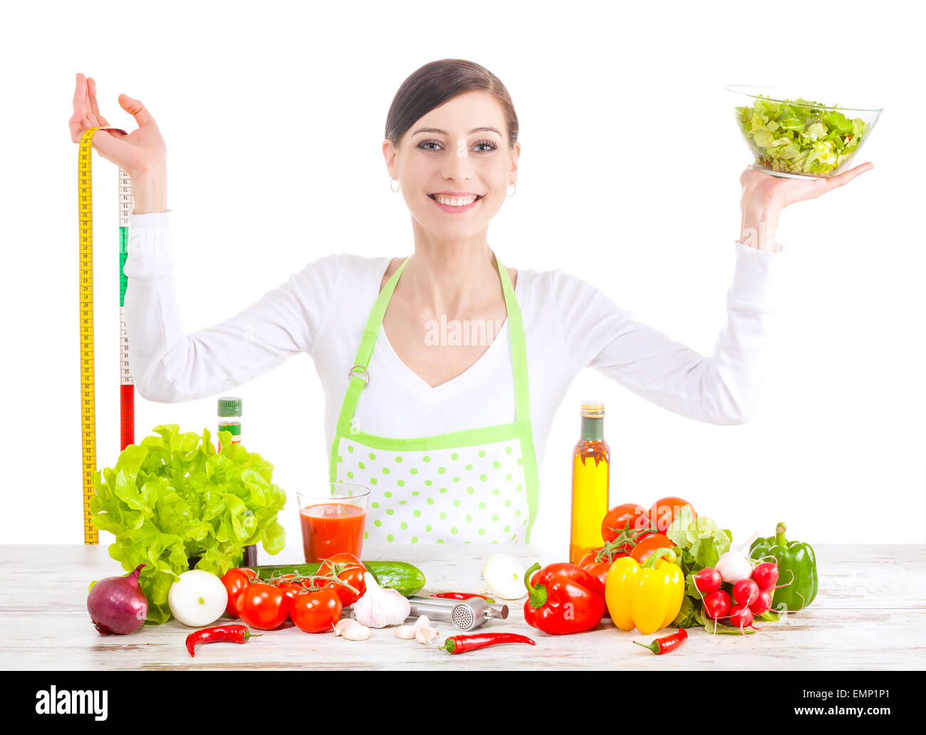Young happy woman with salad and measuring tape, healthy food and diet concept. Stock Photo